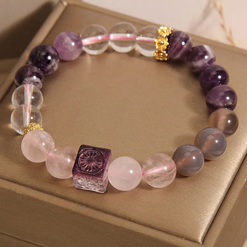 Purple women's amethyst crystal bracelet with rhinestone detailing measuring 10mm diameter