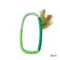 Green circular cotton rope cat toy with feathers and catnip for safe chewing