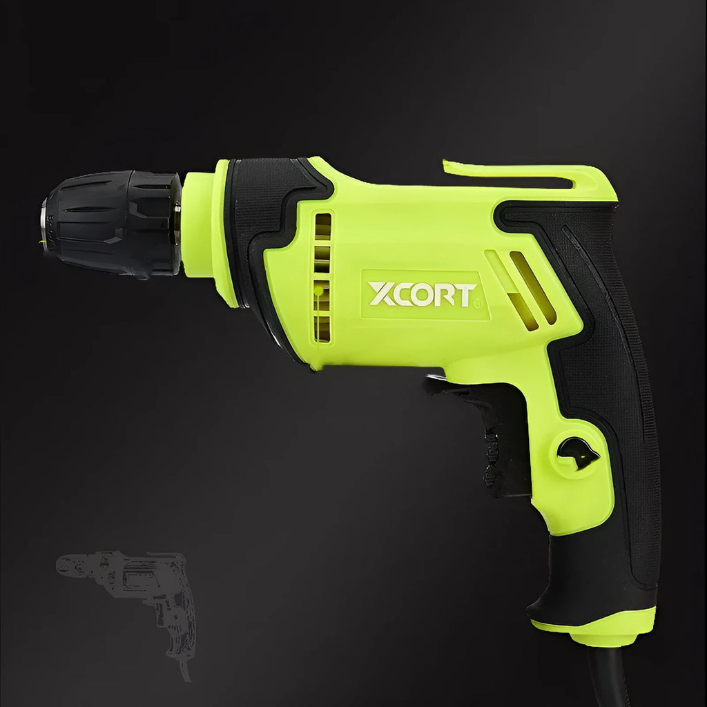 Pistol-grip electric power drill with a black and orange casing on a workbench.