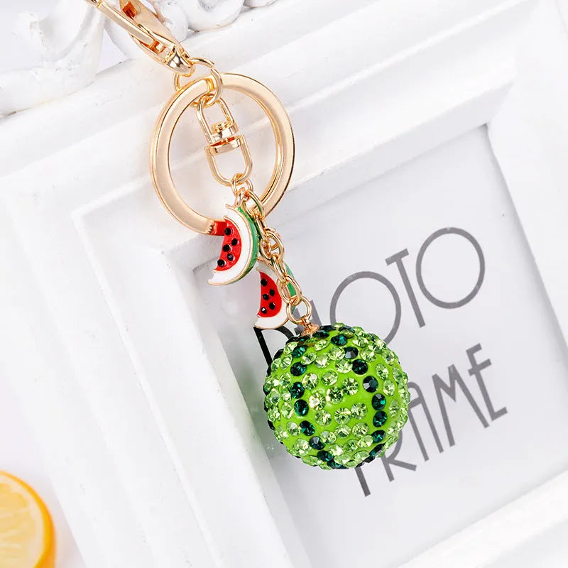 Green zinc alloy watermelon keychain with diamond pattern measuring 12 cm