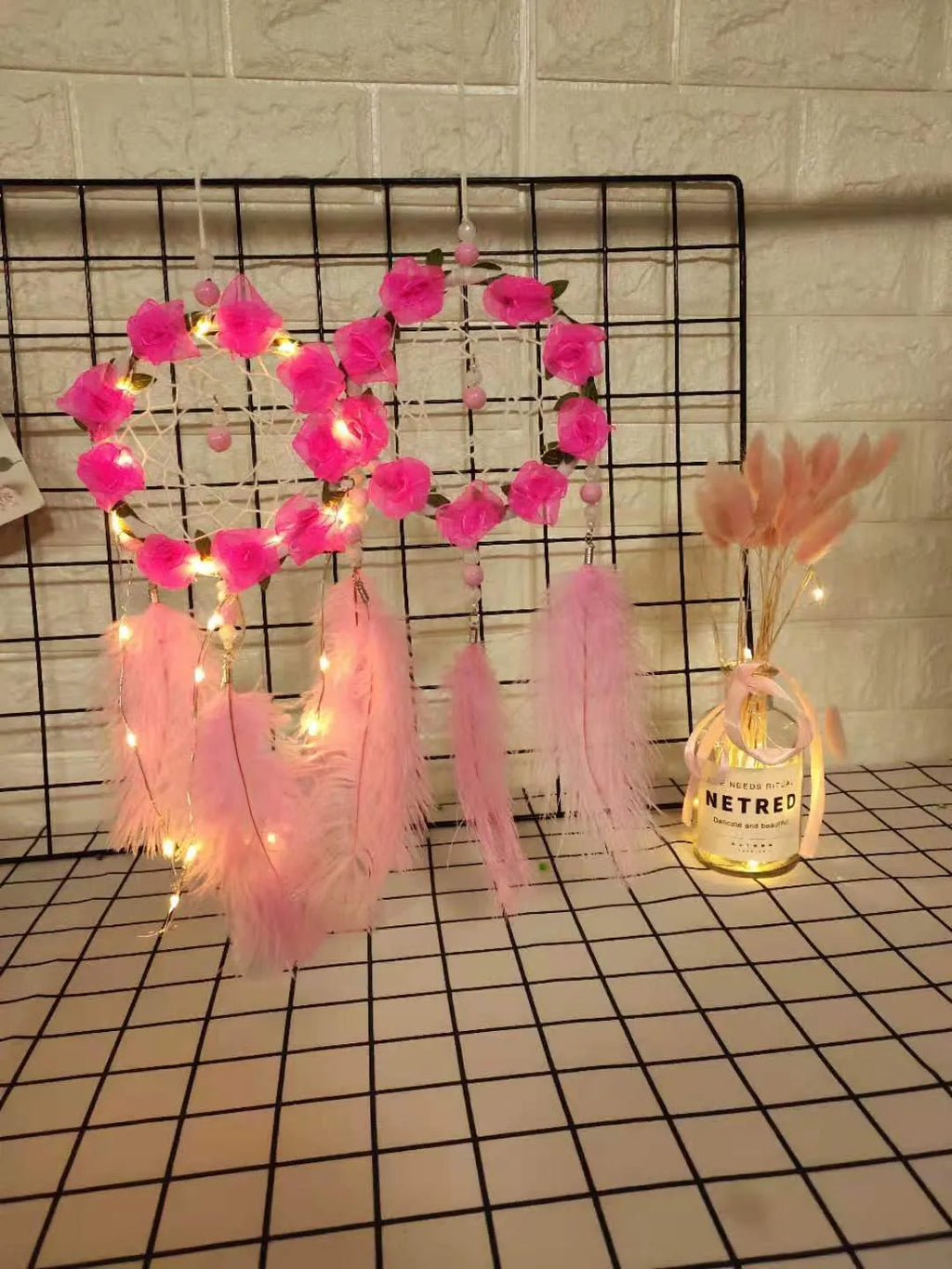 Pink ostrich feather dreamcatcher wind chime wall decoration measuring 10cm