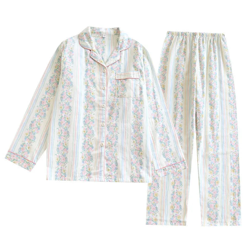 Women's cotton gauze pyjama set with long sleeves and trousers in stripe and red fruit patterns.