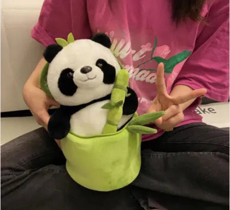 Black and white panda plush doll holding green bamboo tube, soft toy with PP cotton filling