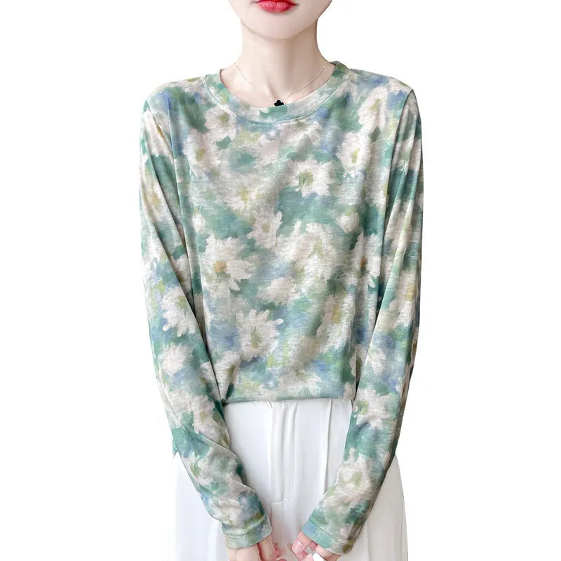 Women's round neck knitted pullover in a Tencel cotton blend with a printed floral design on the front.