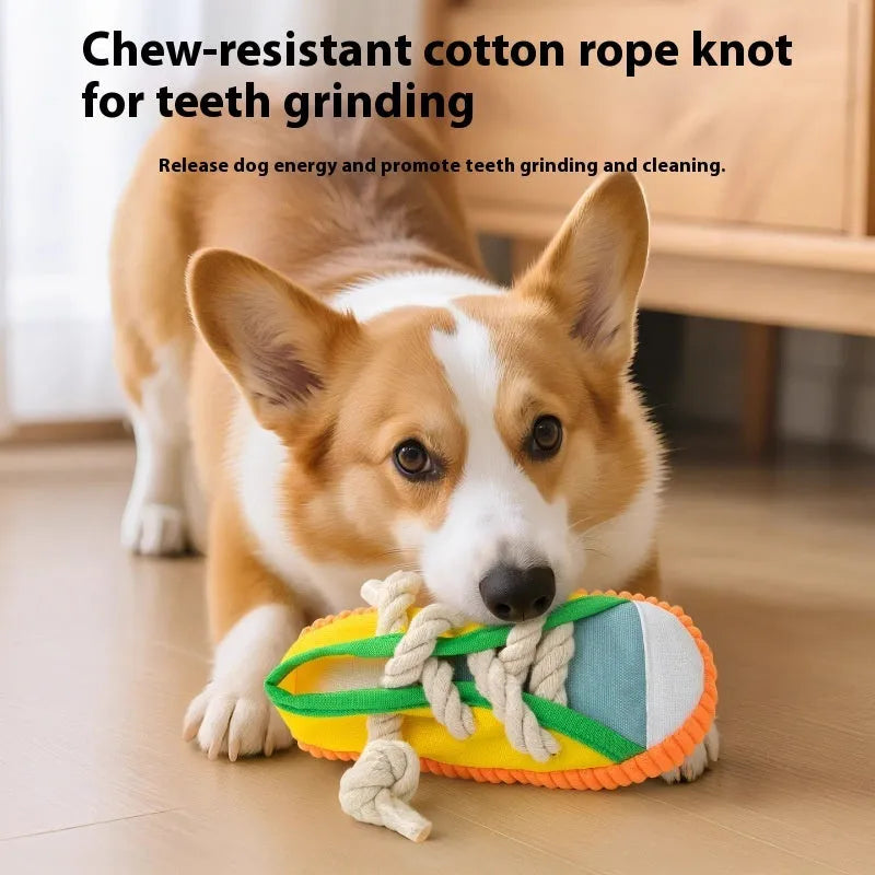 Yellow plastic dog slipper chew toy with a self-hi sound feature for biting.
