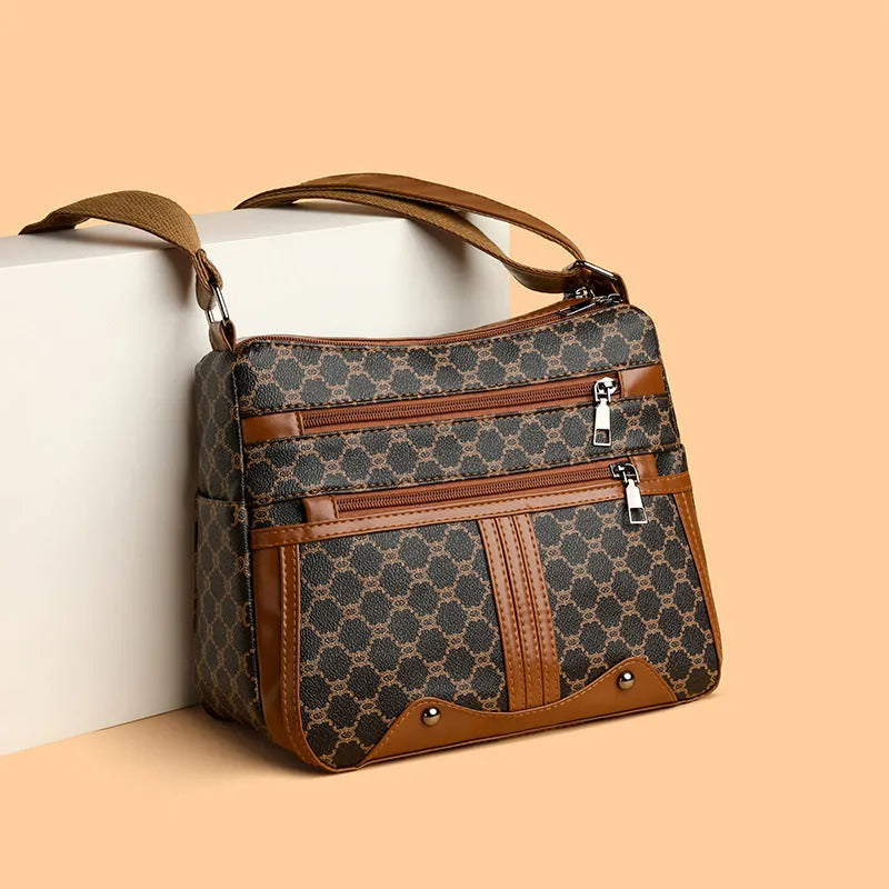Brown women's crossbody bag with stitching pattern design and adjustable strap