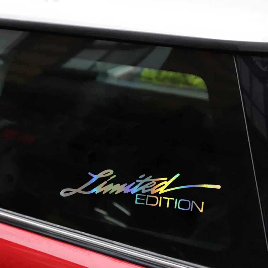 Black laser reflective vinyl car sticker with text, shown on a roll for a vehicle window.