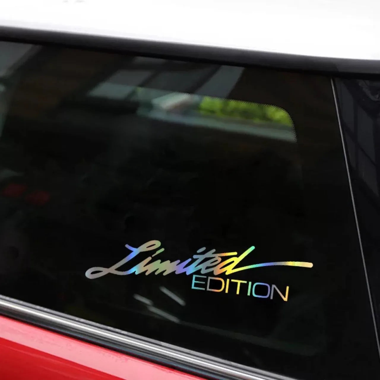 Black laser reflective vinyl car sticker with text, shown on a roll for a vehicle window.