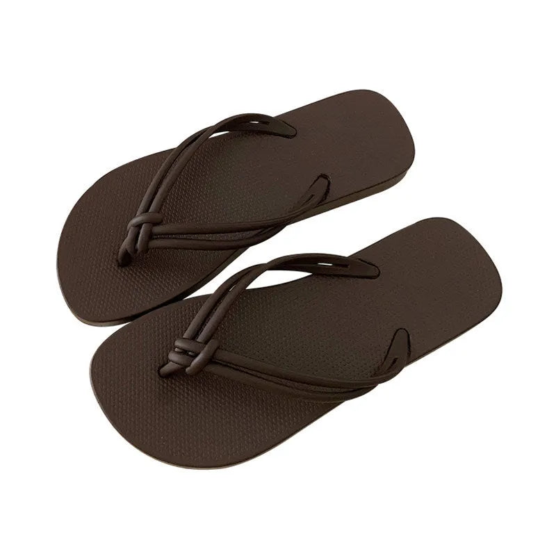 Men's PVC flip flops in beige with a non-slip sole and toe-covering style.