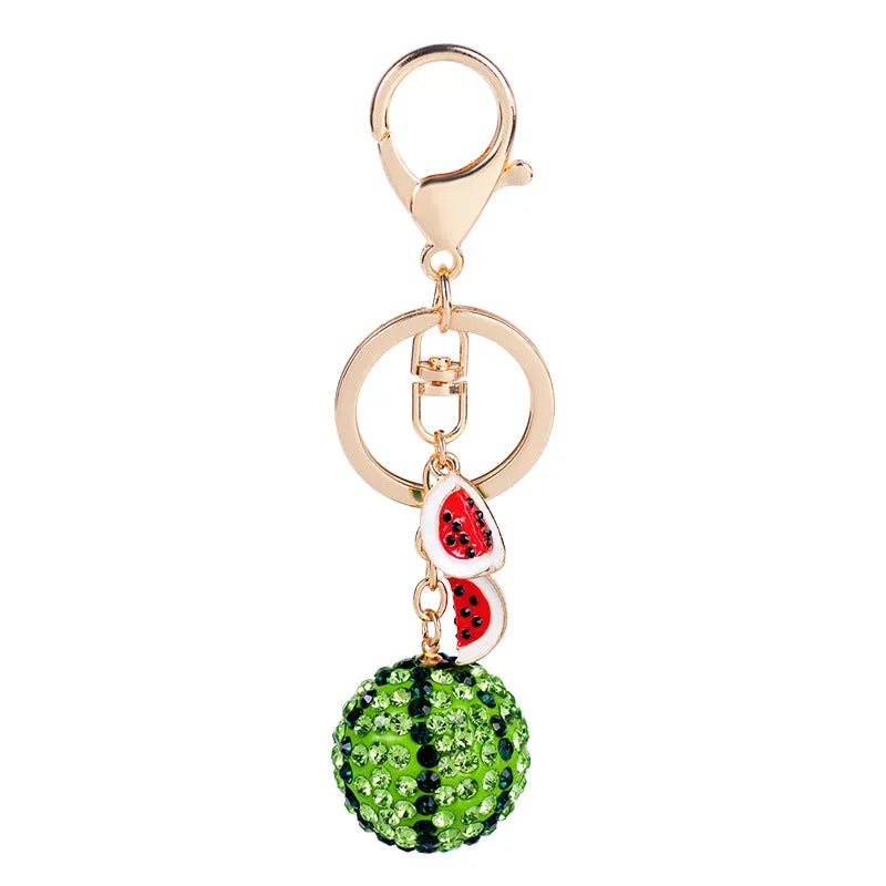 Green zinc alloy watermelon keychain with diamond pattern measuring 12 cm