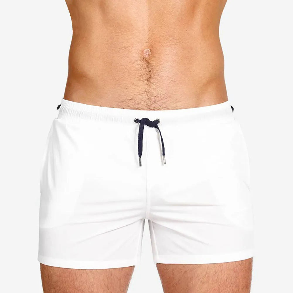Men's solid colour swimming shorts with mesh lining in army green, shown on a white background.