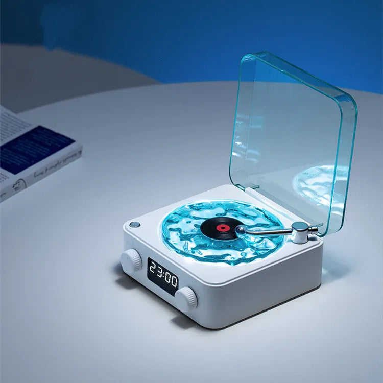 Blue retro-style Bluetooth speaker with rotating transparent turntable and RGB projection lighting