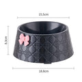 Set of four pet food bowls with bowknot design and diamond pattern in pink, silver, black, purple, and white colours.