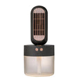 Small black and white portable humidifier fan with oscillating head on desk