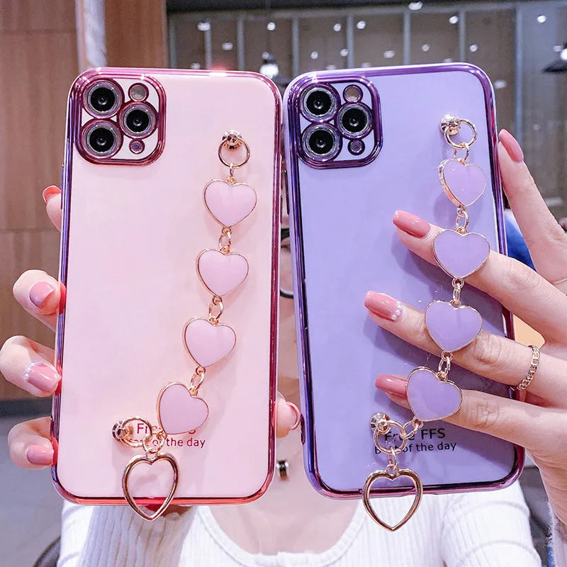 Samsung mobile phone in a solid colour silicone case with an adjustable bracelet strap attached.