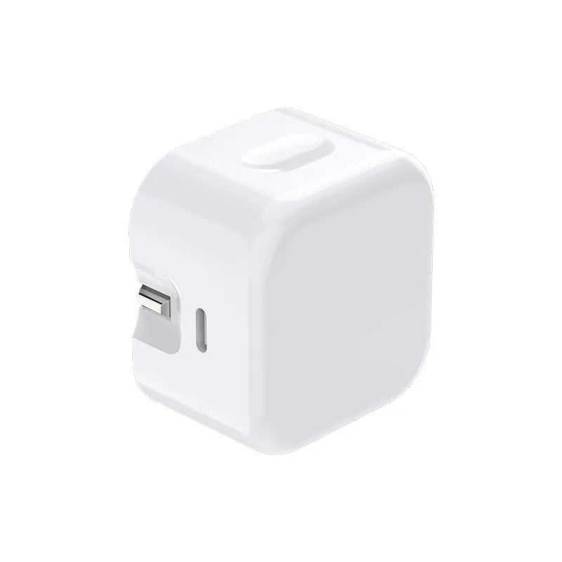 White 20W USB-C PD fast charger with UK plug and a coiled charging cable.