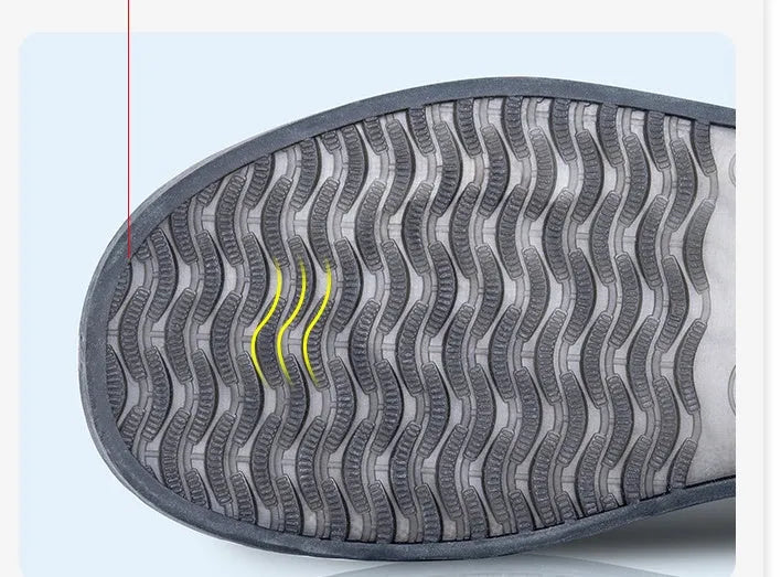 White PVC high-top reusable waterproof shoe cover for women, shown on a foot.