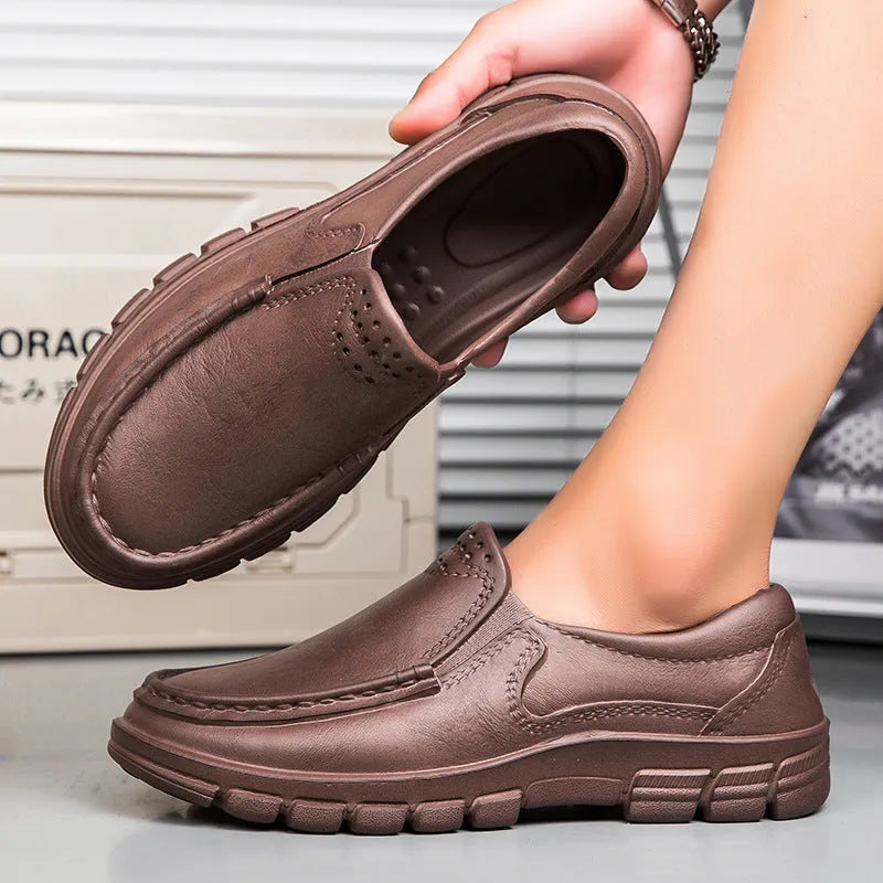 Men's black slip-on work shoes with artificial leather uppers and platform heel design