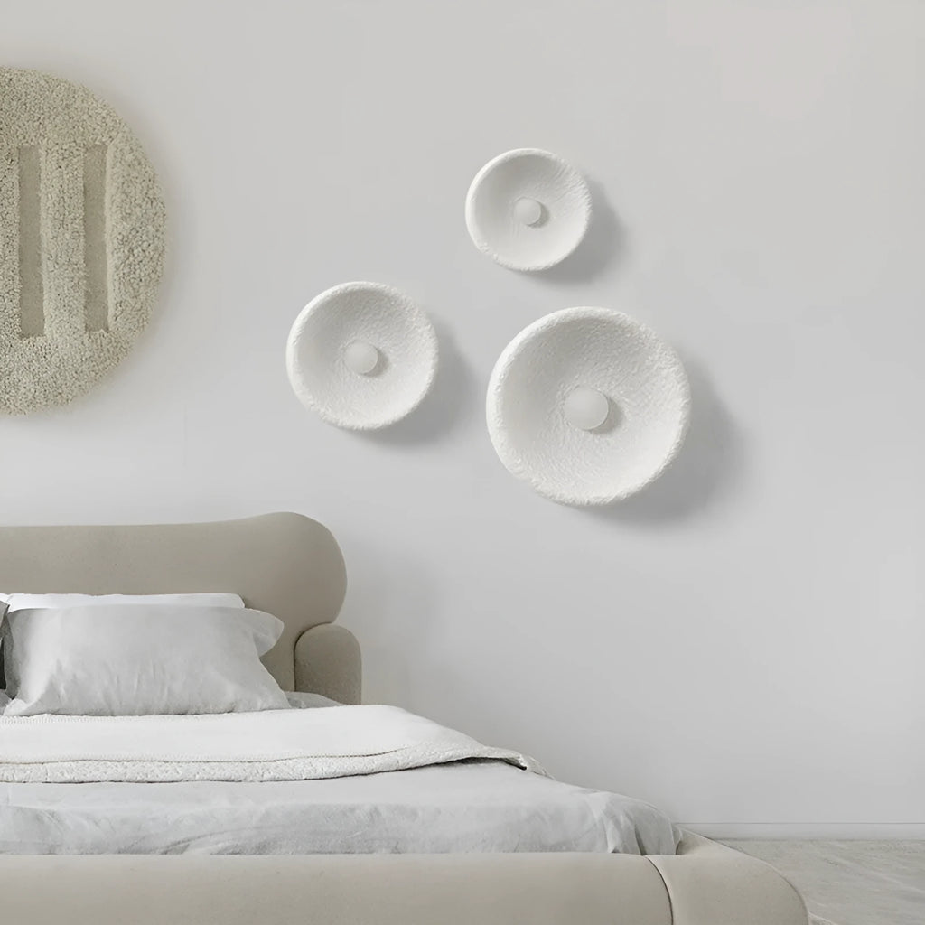 Japanese-style modern wall lamp with white resin shade in three size options.