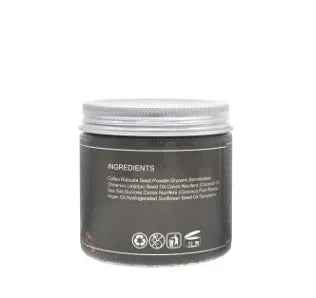 Coconut oil coffee scrub in a jar with natural exfoliating granules for deep cleansing and cellulite reduction