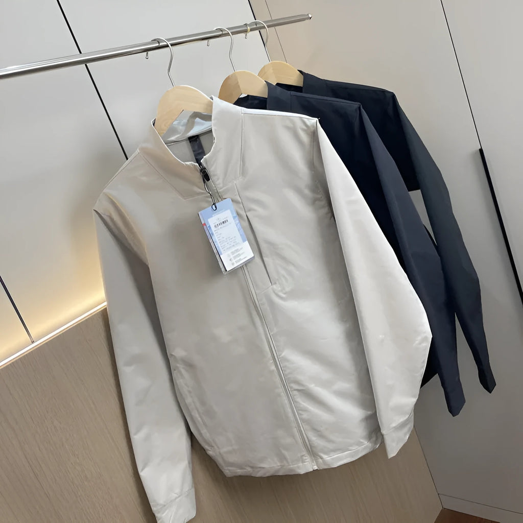 Men's beige stand collar polyester casual jacket with long sleeves and straight hem.
