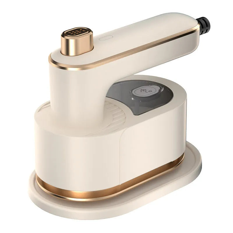 Folding handheld garment steamer in beige with compact design for travel