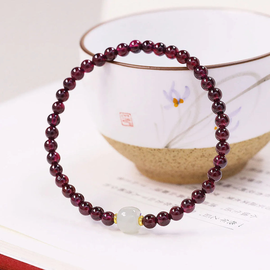 Women's U-shaped garnet bracelet in 18mm size with polished beads