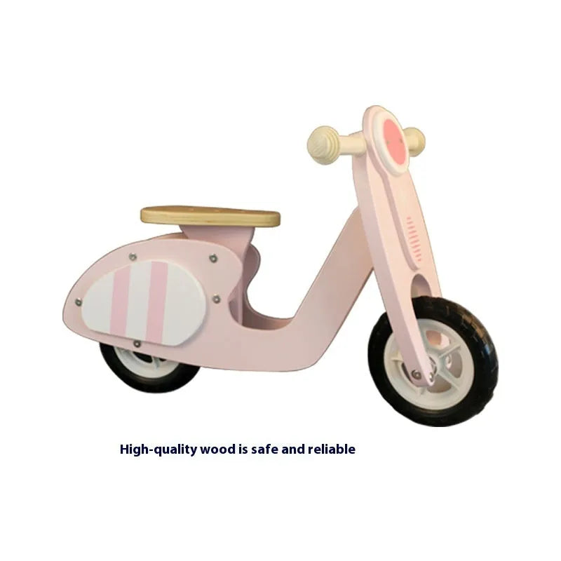 Pink wooden balance scooter for toddlers, 10 inches long, for children aged 1-6 years.