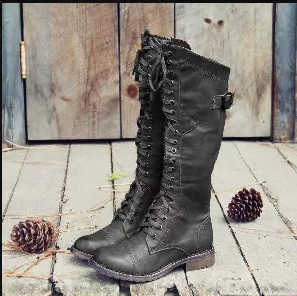 Women's black chunky heel lace-up ankle boots on a white background