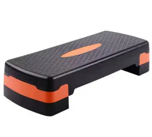 Grey Fit step aerobics platform on a wooden floor