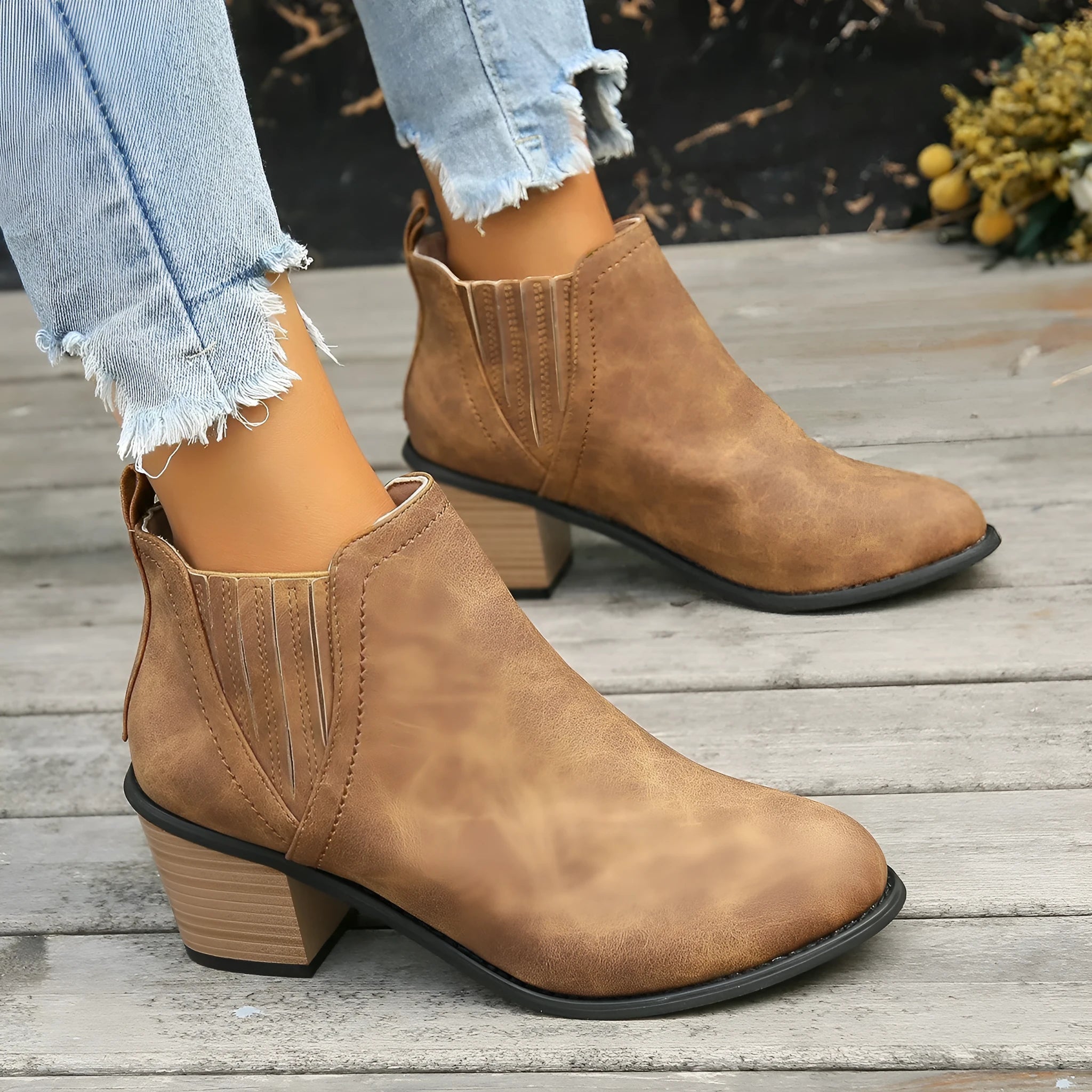 Women's black pointed toe ankle boots with thick square heel slip-on design