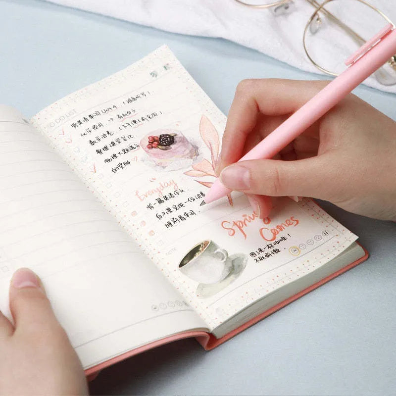 A simple portable todolist notebook in morandi blue with a PU cover, shown next to a pen.