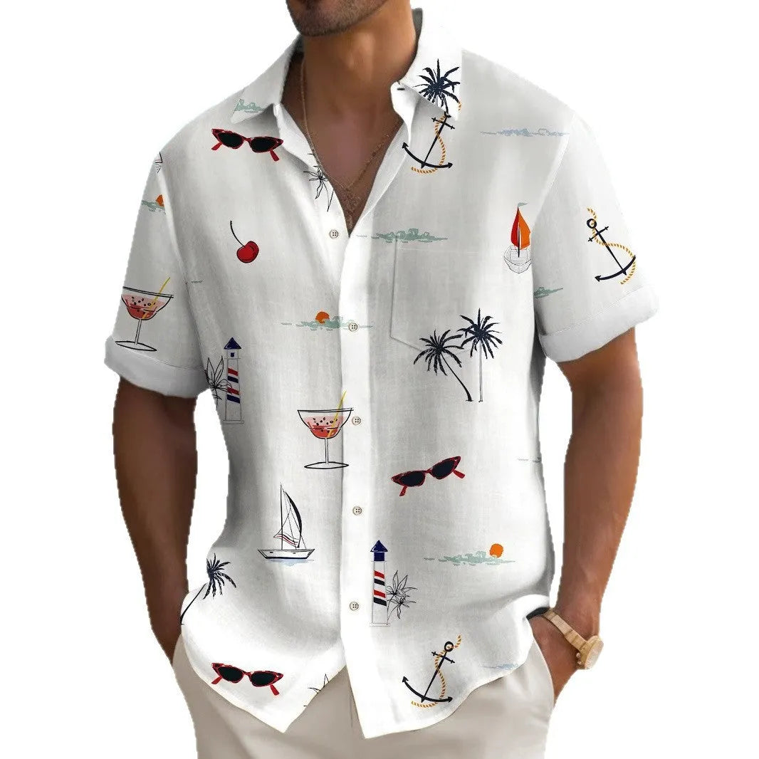 Man wearing a colourful loose-fit Hawaiian print short sleeve shirt on a beach.
