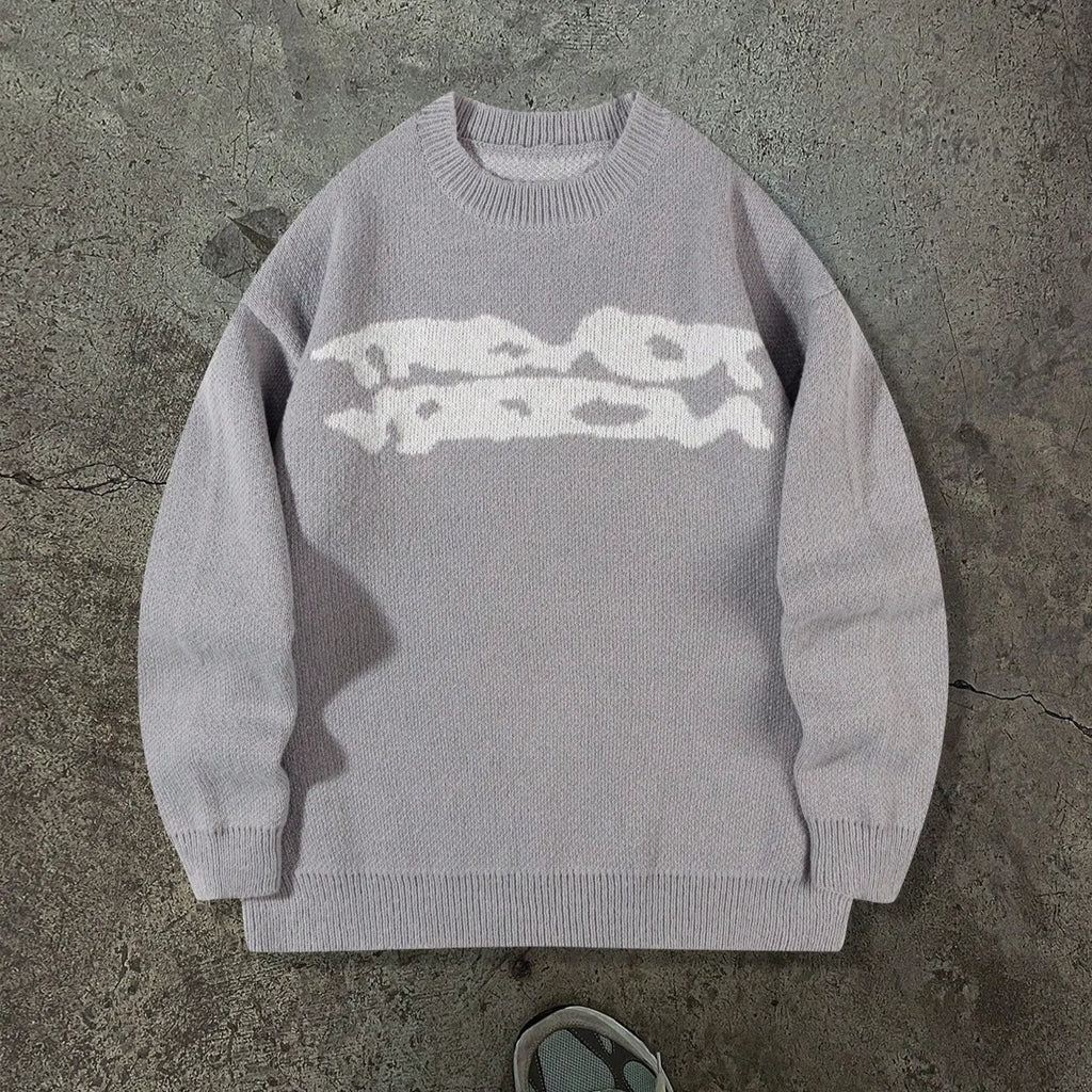 Loose geometric jacquard pullover knitted sweater in gray, front view, showing textured pattern and relaxed fit