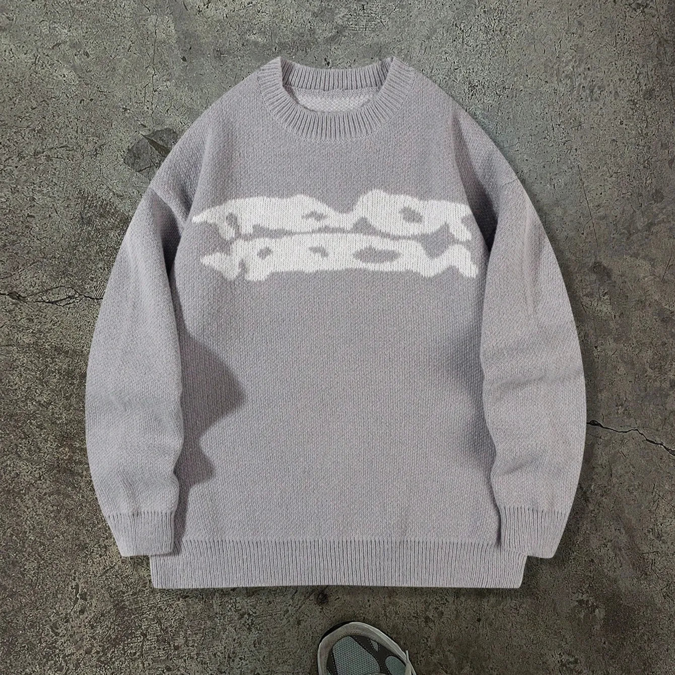 Loose geometric jacquard pullover knitted sweater in gray, front view, showing textured pattern and relaxed fit