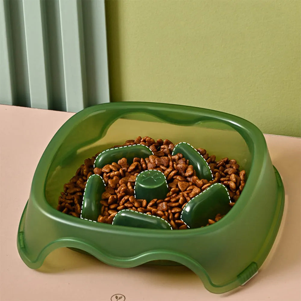 Blue plastic slow feeder dog bowl with raised internal maze pattern to prevent fast eating.