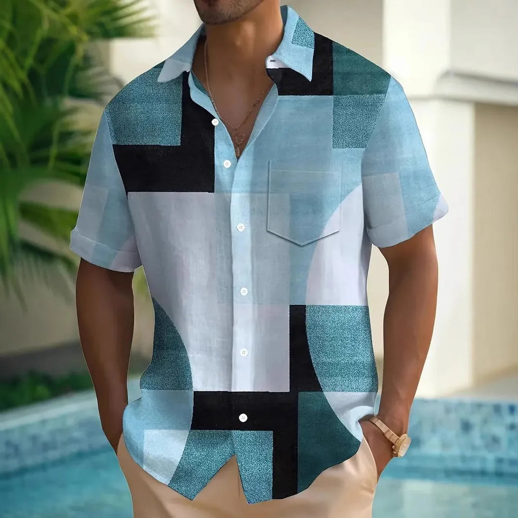 Man wearing a loose-fit cardigan shirt with a retro geometric square print in contrasting colours.