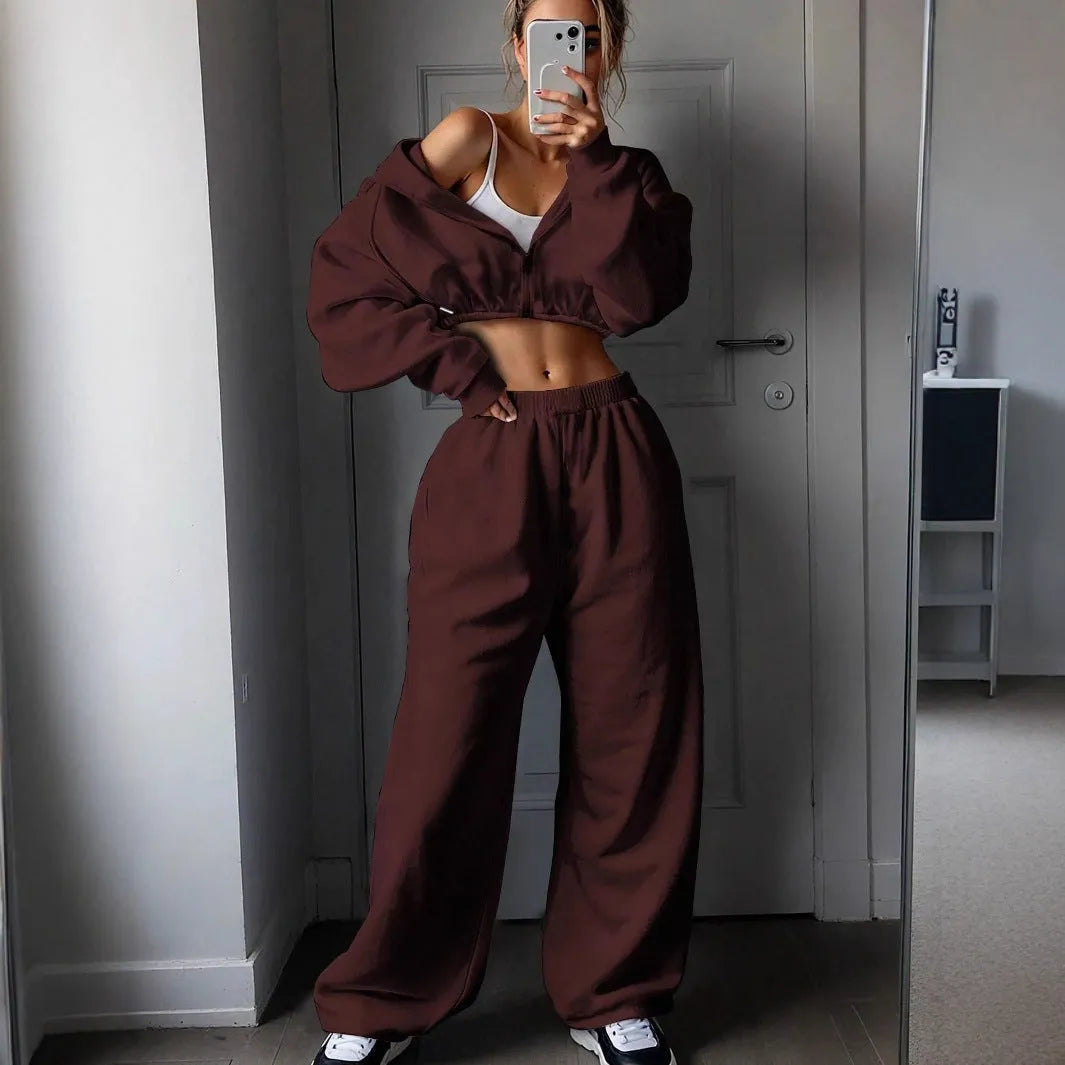Long sleeve polyester sports sweater suit two-piece set in light grey, showing coat and trousers.