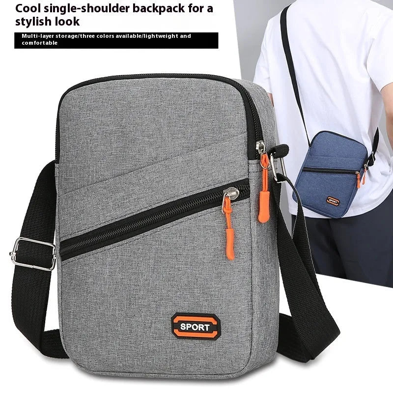 Solid colour Oxford cloth commuter bag with contrast detailing and crossbody shoulder strap