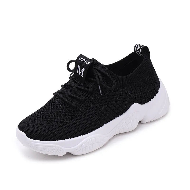 Women's white thick-soled woven sports shoes with front strap on a light background.