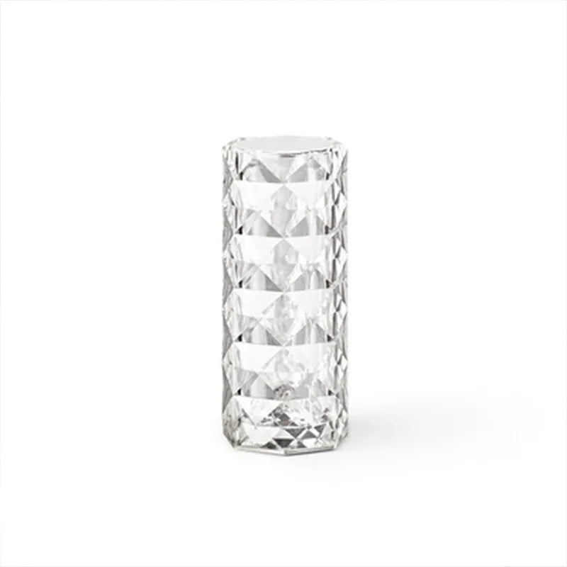 LED rose diamond shaped table lamp with acrylic construction and three-tone lighting on a wooden surface.