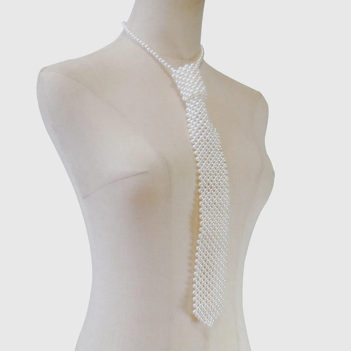 Retro hollow out imitation pearl body chain with alloy tie fastening in black colour