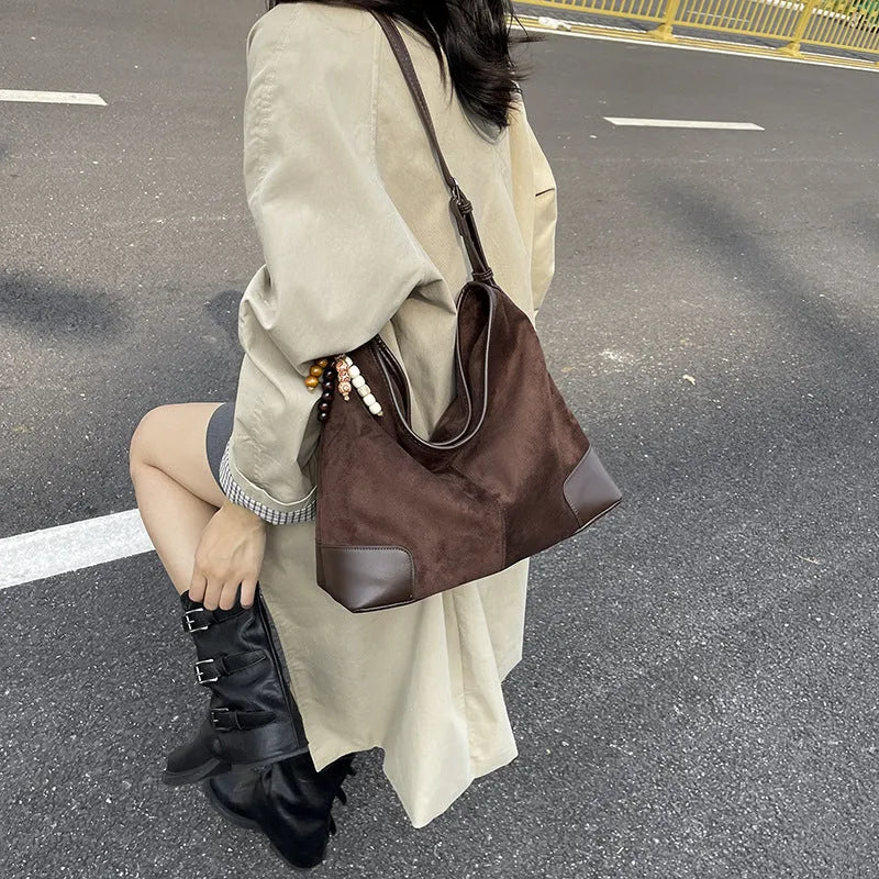 Women's PU leather retro shoulder crossbody bag in brown with ribbon pendant, horizontal shape, sandwich pocket