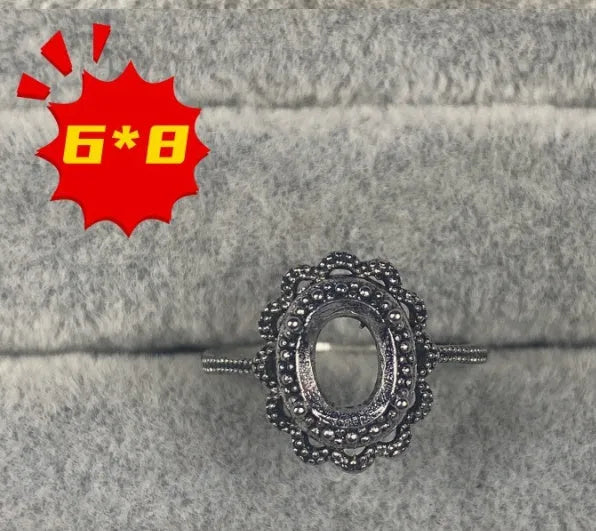Oval denier ring with 6x8mm stone and five-pointed star detail on electroplated copper band
