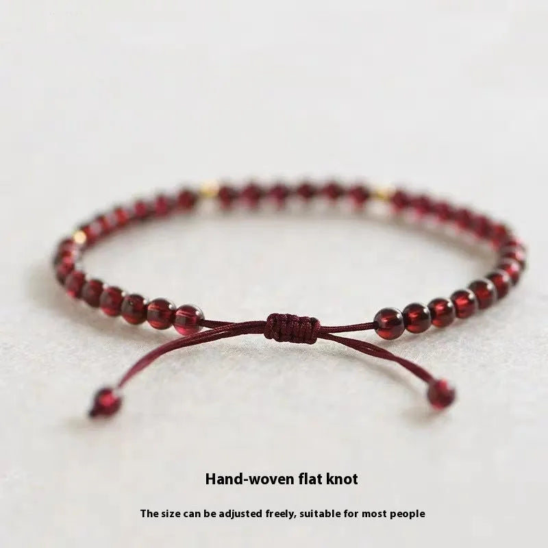 Hand-woven garnet bracelet with national tide styling and flexible wire construction