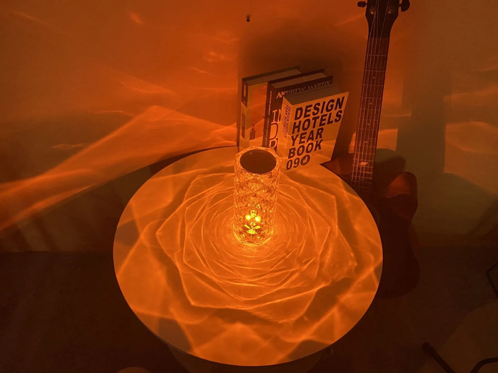 LED rose diamond shaped table lamp with acrylic construction and three-tone lighting on a wooden surface.
