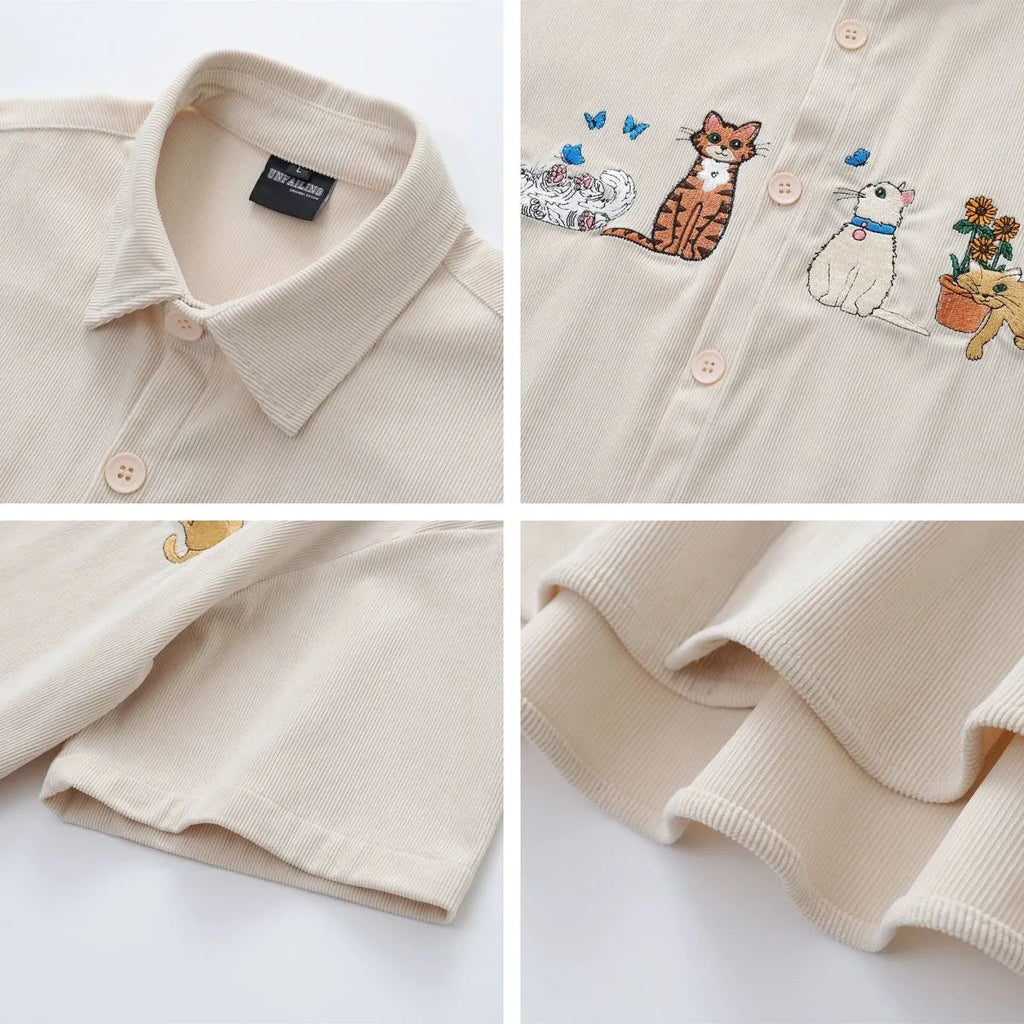 Loose apricot cardigan shirt with cartoon embroidery pattern on a hanger.