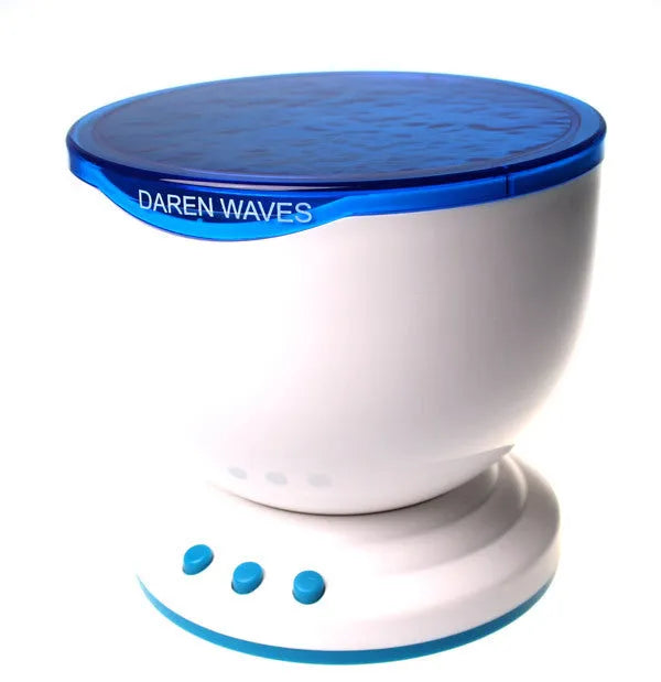 Blue ocean theme LED projection lamp for children's rooms on a wooden surface.
