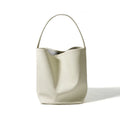 Genuine leather bucket bag for women in beige, large capacity, with open pocket and patchwork design, shoulder style