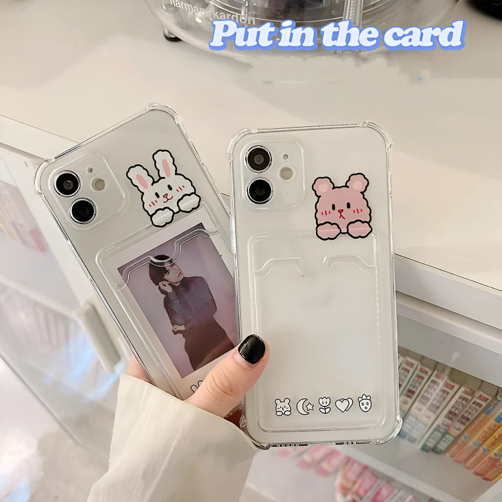 Clear cartoon-patterned iPhone case with a built-in card holder on the back.